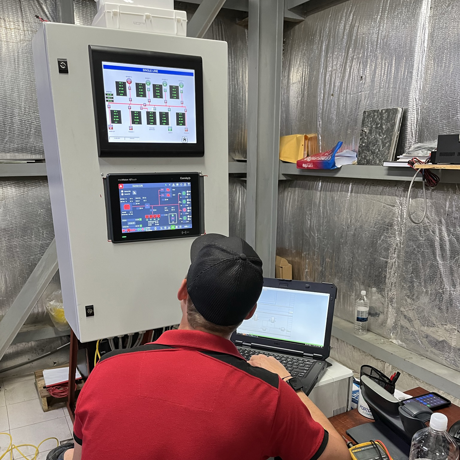 ComAp technician installing a hybrid microgrid control system